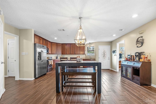 dining area with a textured ceiling