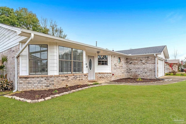 single story home featuring a garage and a front lawn