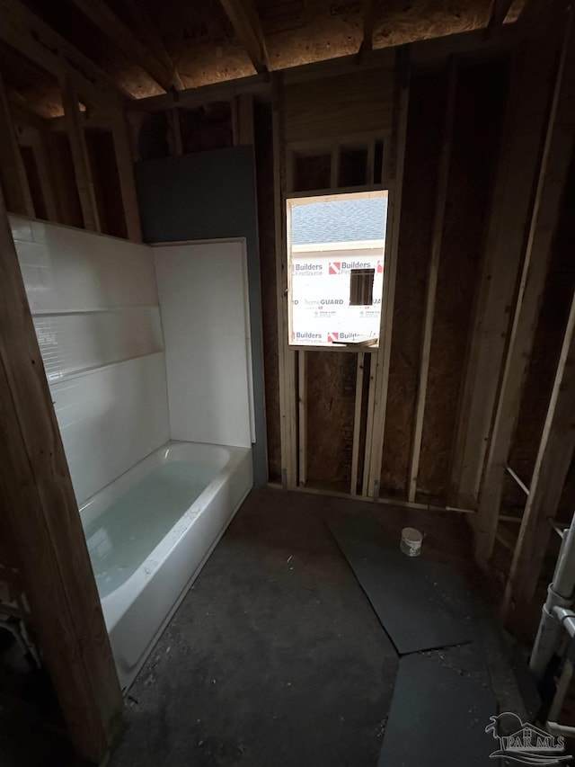 bathroom featuring a washtub