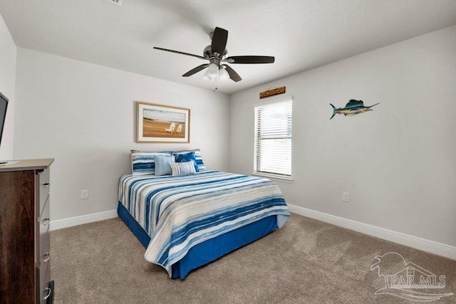 bedroom with light carpet, ceiling fan, and baseboards