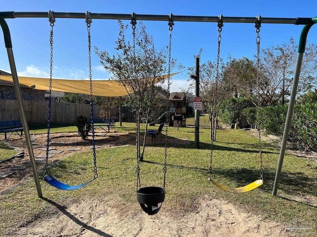 view of yard featuring fence and a playground