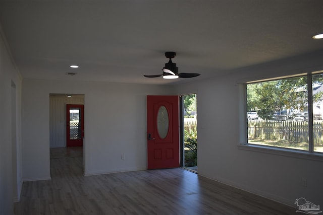 foyer entrance with wood finished floors, a ceiling fan, recessed lighting, and baseboards