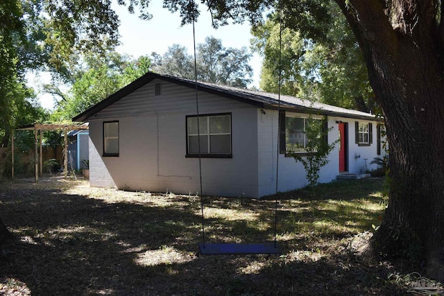 view of property exterior featuring concrete block siding