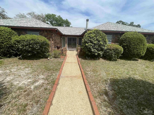 7844 Bay Meadows Dr, Pensacola, FL 32507 - view of front of home featuring a shingled roof, french doors, and brick siding