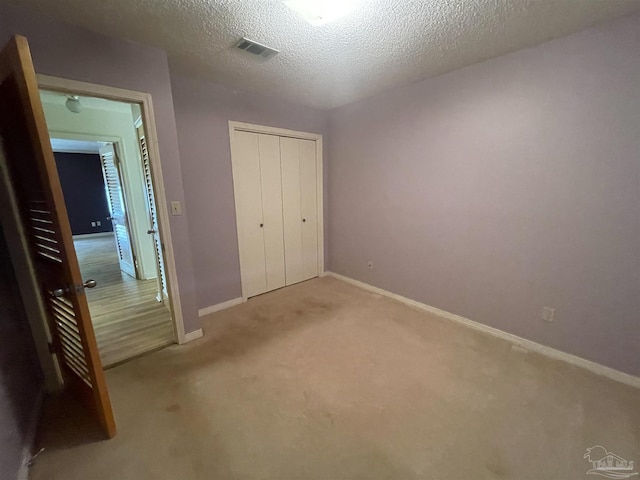 7844 Bay Meadows Dr, Pensacola, FL 32507 - unfurnished bedroom featuring a closet, carpet, visible vents, and baseboards