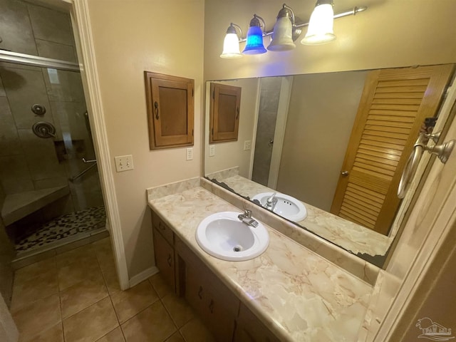 7844 Bay Meadows Dr, Pensacola, FL 32507 - bathroom with baseboards, a shower stall, tile patterned flooring, and vanity