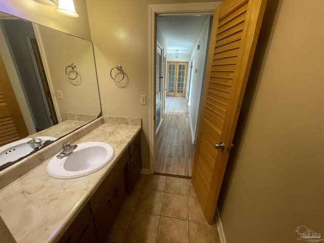 7844 Bay Meadows Dr, Pensacola, FL 32507 - bathroom with baseboards, tile patterned flooring, and vanity