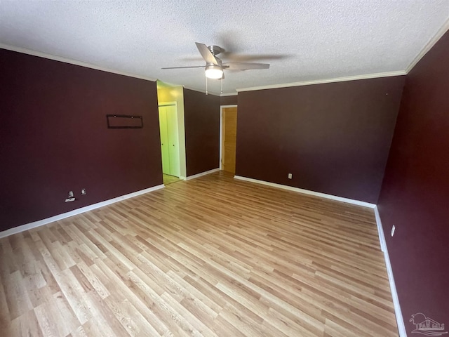 7844 Bay Meadows Dr, Pensacola, FL 32507 - spare room featuring light wood finished floors, ornamental molding, baseboards, a textured ceiling, and ceiling fan
