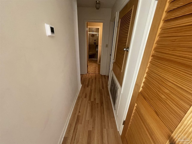 7844 Bay Meadows Dr, Pensacola, FL 32507 - corridor with visible vents, baseboards, and wood finished floors