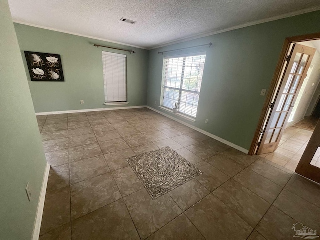 7844 Bay Meadows Dr, Pensacola, FL 32507 - empty room featuring a textured ceiling, visible vents, tile patterned flooring, and ornamental molding