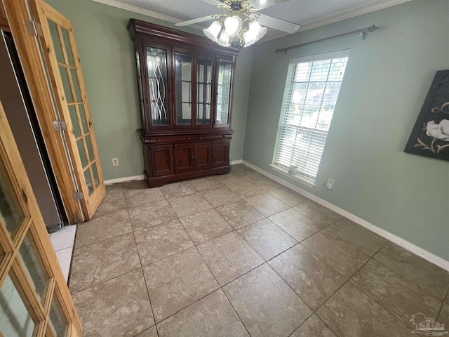 7844 Bay Meadows Dr, Pensacola, FL 32507 - unfurnished room featuring baseboards, ornamental molding, ceiling fan, and light tile patterned flooring