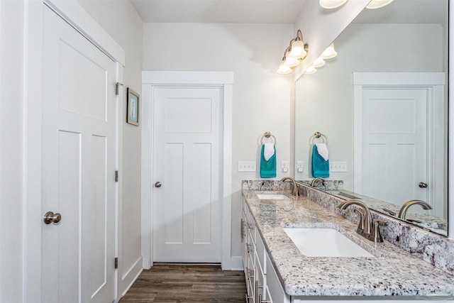 bathroom with vanity and hardwood / wood-style floors