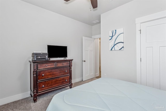 bedroom with light colored carpet and ceiling fan