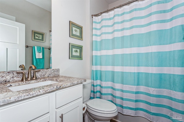 bathroom with vanity, toilet, and a shower with curtain