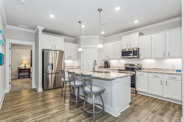 kitchen featuring stainless steel appliances, sink, and white cabinets