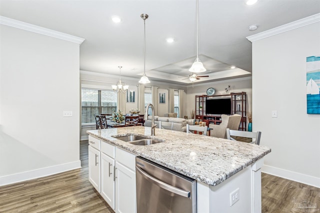 kitchen featuring pendant lighting, sink, white cabinetry, an island with sink, and stainless steel dishwasher