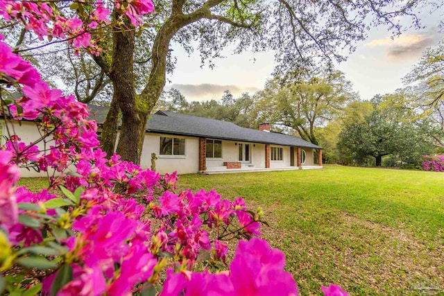 exterior space with a yard