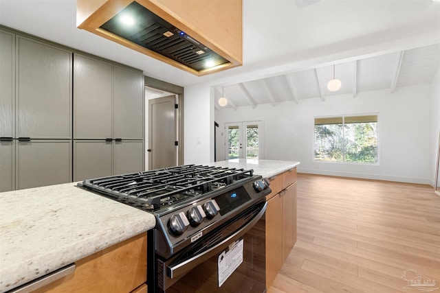 kitchen featuring vaulted ceiling with beams, light stone countertops, light hardwood / wood-style floors, gas range, and french doors