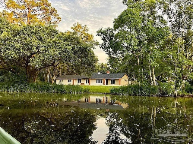 view of community with a water view