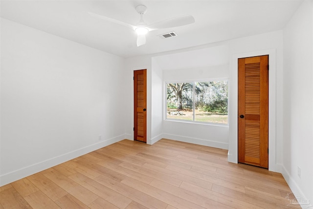 unfurnished bedroom featuring light hardwood / wood-style floors and ceiling fan