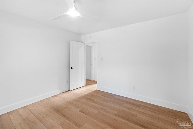 unfurnished room featuring light wood-type flooring and ceiling fan