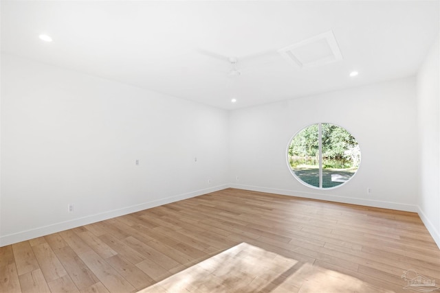 spare room with light hardwood / wood-style flooring