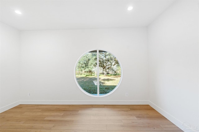 empty room with light hardwood / wood-style floors