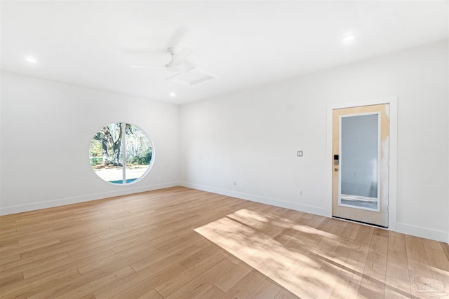 empty room featuring ceiling fan and light hardwood / wood-style flooring