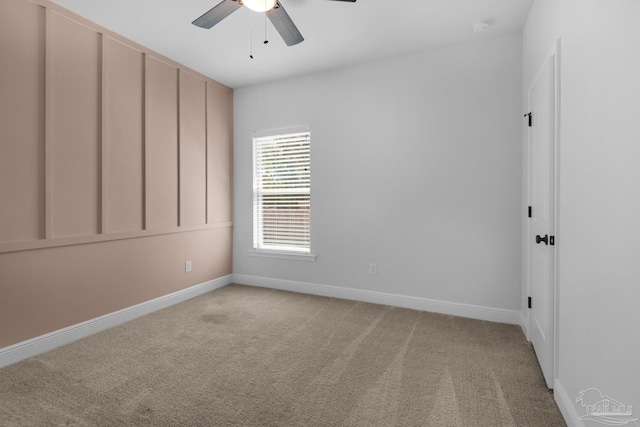 empty room with light carpet, baseboards, and ceiling fan