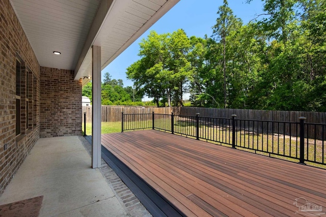 deck with a fenced backyard