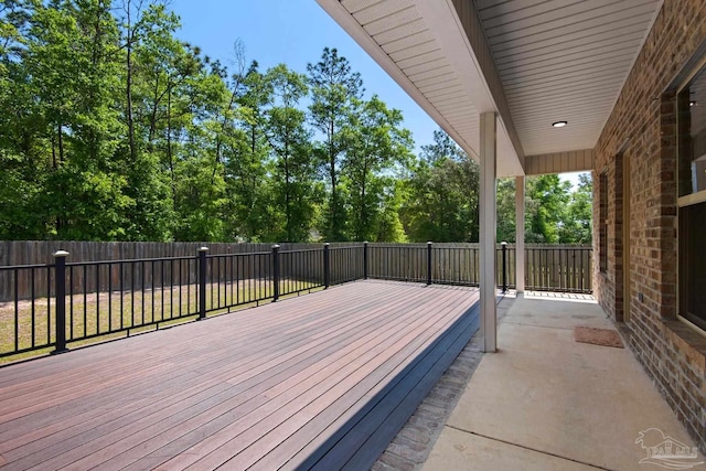 wooden terrace with fence private yard