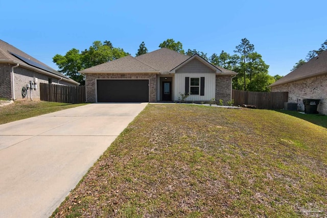 ranch-style house featuring concrete driveway, an attached garage, fence, and a front yard