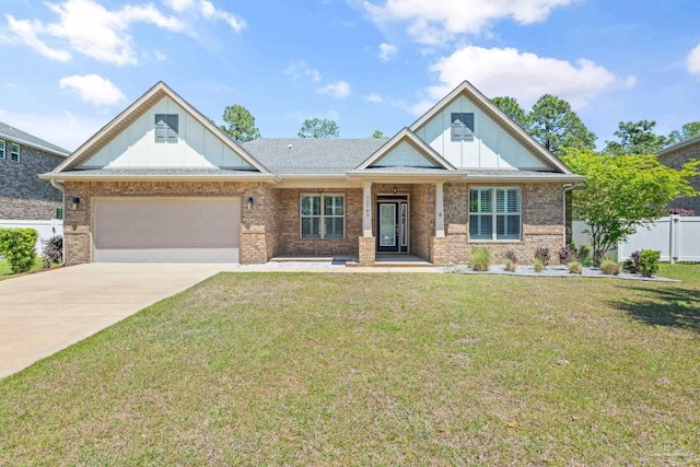 12789 Island Spirit Dr, Pensacola, FL 32506 - craftsman house with driveway, an attached garage, fence, a front yard, and brick siding