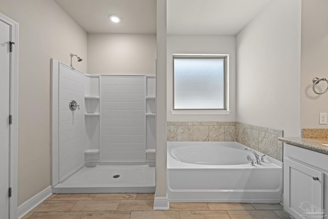 12789 Island Spirit Dr, Pensacola, FL 32506 - bathroom featuring a garden tub, vanity, and a walk in shower