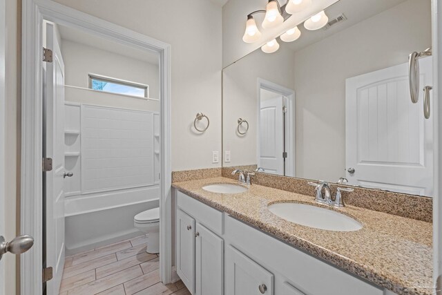 12789 Island Spirit Dr, Pensacola, FL 32506 - full bath featuring double vanity, visible vents, toilet, and a sink