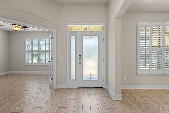 12789 Island Spirit Dr, Pensacola, FL 32506 - foyer entrance with light wood finished floors, baseboards, and ceiling fan