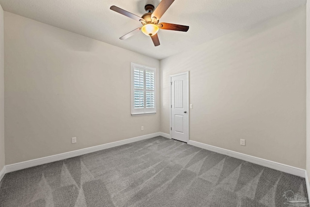 12789 Island Spirit Dr, Pensacola, FL 32506 - unfurnished room with dark carpet, ceiling fan, and baseboards