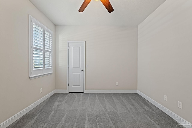 12789 Island Spirit Dr, Pensacola, FL 32506 - empty room featuring a ceiling fan, baseboards, and carpet