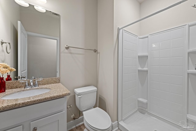 12789 Island Spirit Dr, Pensacola, FL 32506 - bathroom with a shower stall, toilet, vanity, and baseboards