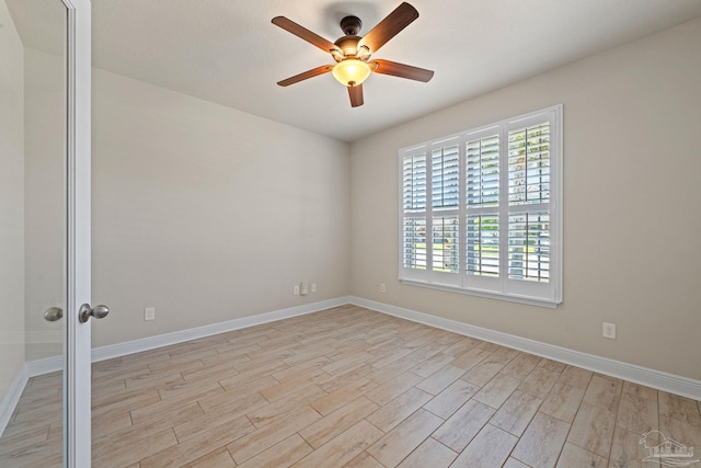 12789 Island Spirit Dr, Pensacola, FL 32506 - empty room with light wood finished floors, baseboards, and ceiling fan