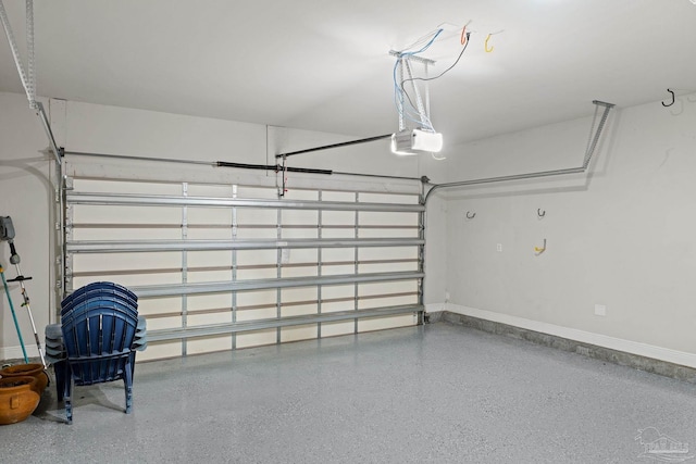 12789 Island Spirit Dr, Pensacola, FL 32506 - garage with baseboards and a garage door opener