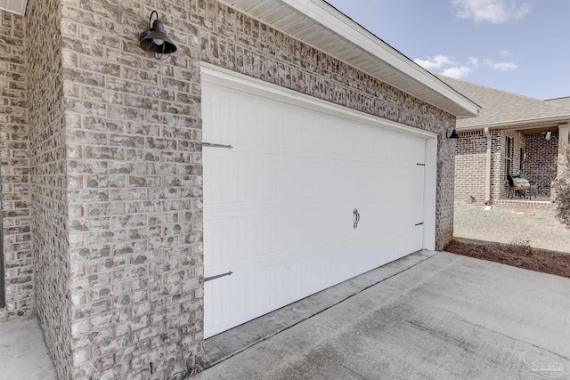 garage featuring driveway