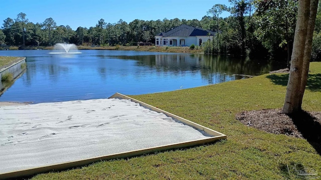 view of dock featuring a yard and a water view