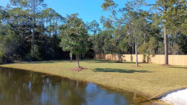 exterior space with a yard and a water view