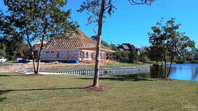 exterior space with a yard and a water view