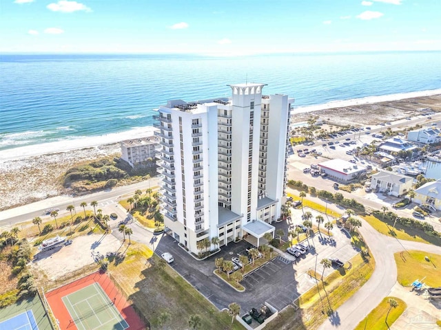 aerial view with a water view and a beach view