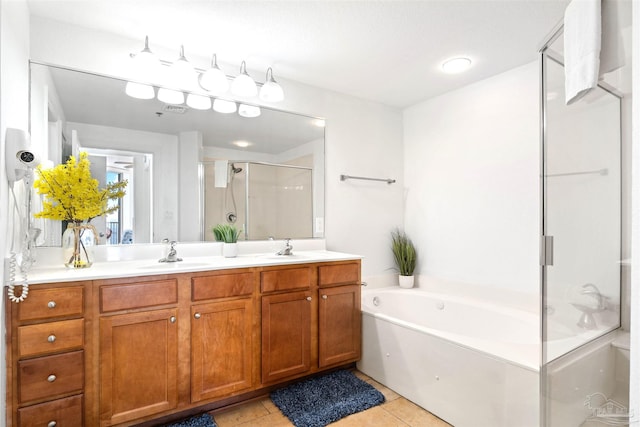 bathroom with tile patterned flooring, vanity, and separate shower and tub