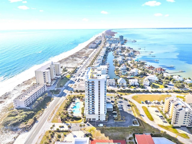 bird's eye view featuring a water view and a view of the beach