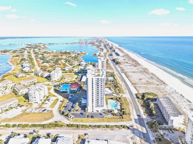 birds eye view of property featuring a water view and a view of the beach