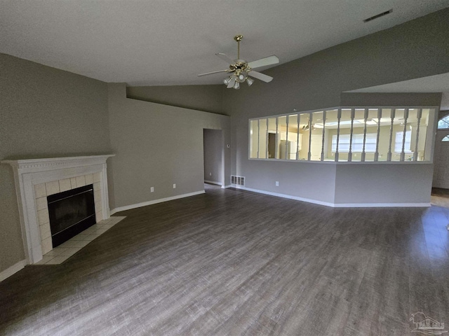 unfurnished living room featuring wood finished floors, a ceiling fan, visible vents, baseboards, and lofted ceiling